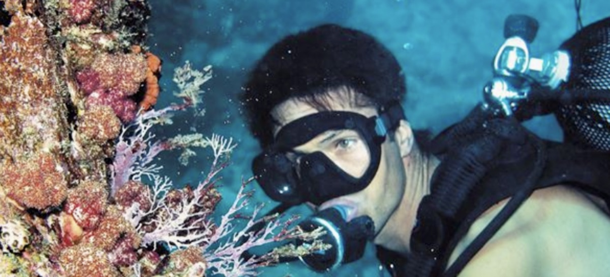 Scuba diver close to a coral reef
